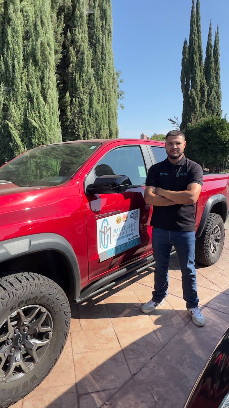 Master Craft Painting founder and owner beside the company truck