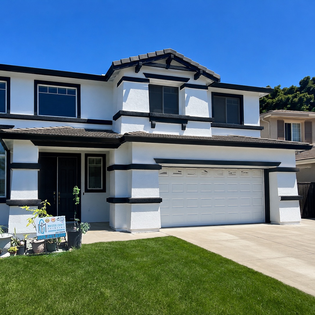Same home after Master Craft Painting, in bright white with bold black trim
